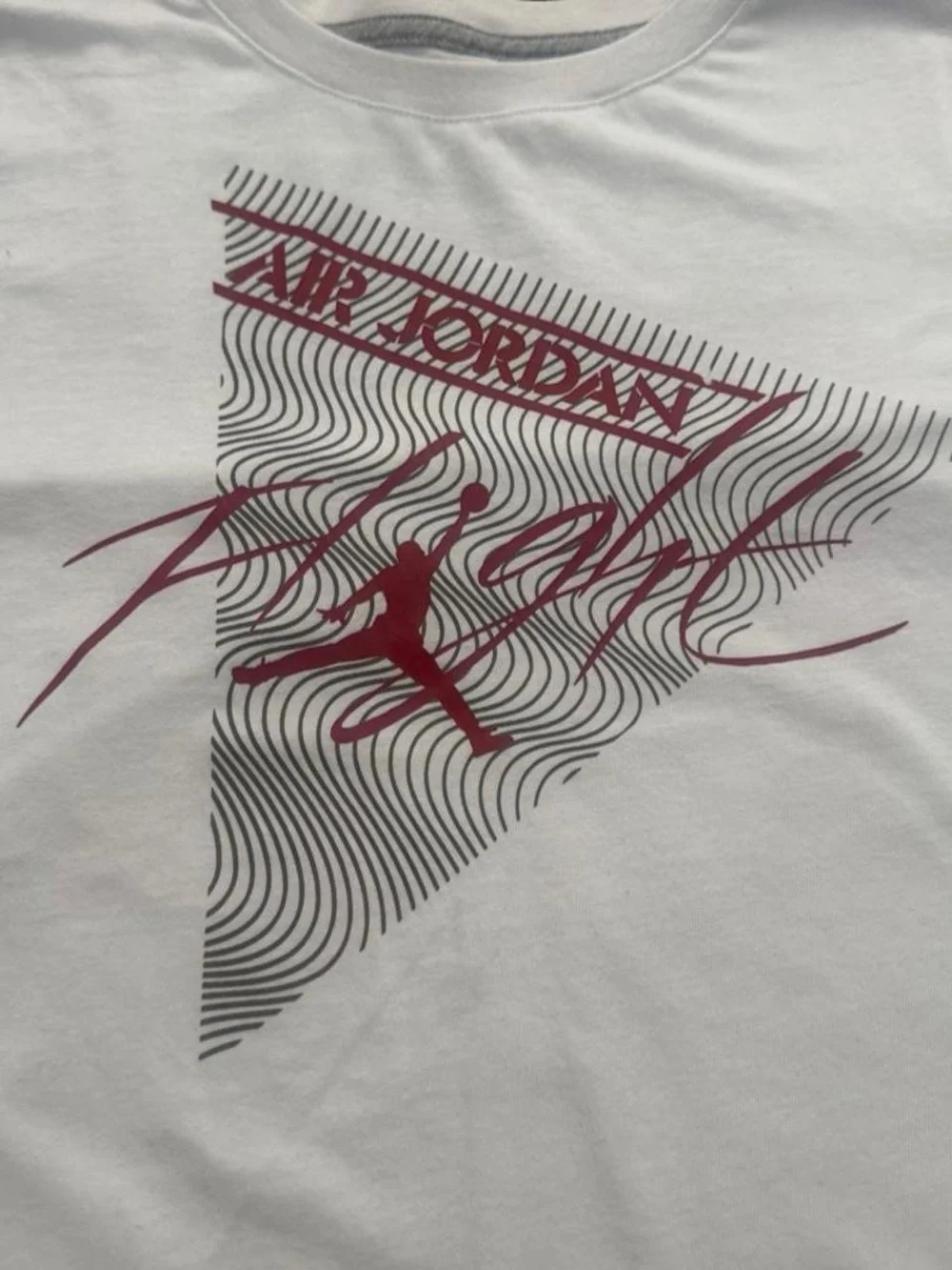 White Jordan kids t-shirt with red Air Jordan logo and 'Flight' text, size L